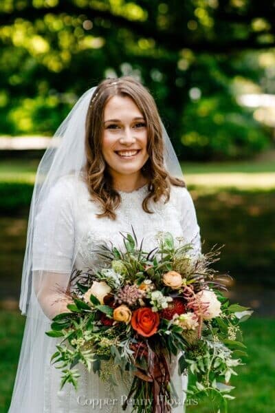 Bride with autumn floral bouquet